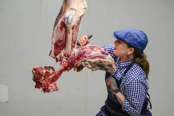 Butcher Girl Alison breaking down a hindquarter of beef. Picture: supplied