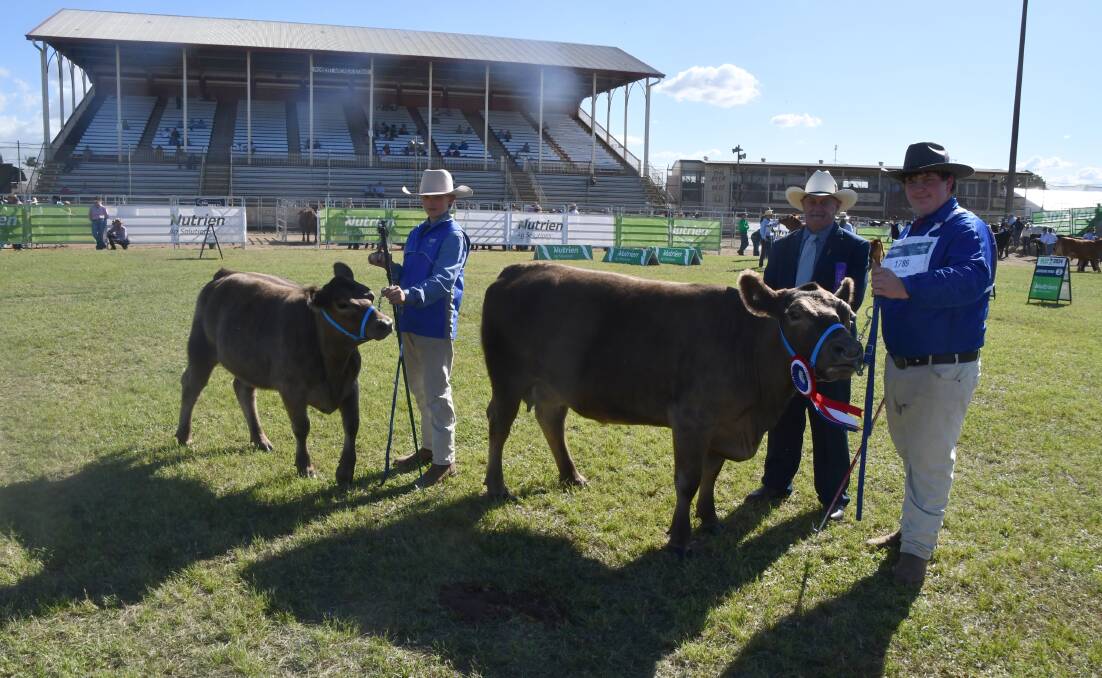 The Square Meaters grand champion female Dakabin Rozella with Dakabin High School students Logan Jannusch and Liam Swanson, and judge Grame Hopf. Picture: Judith Maizey