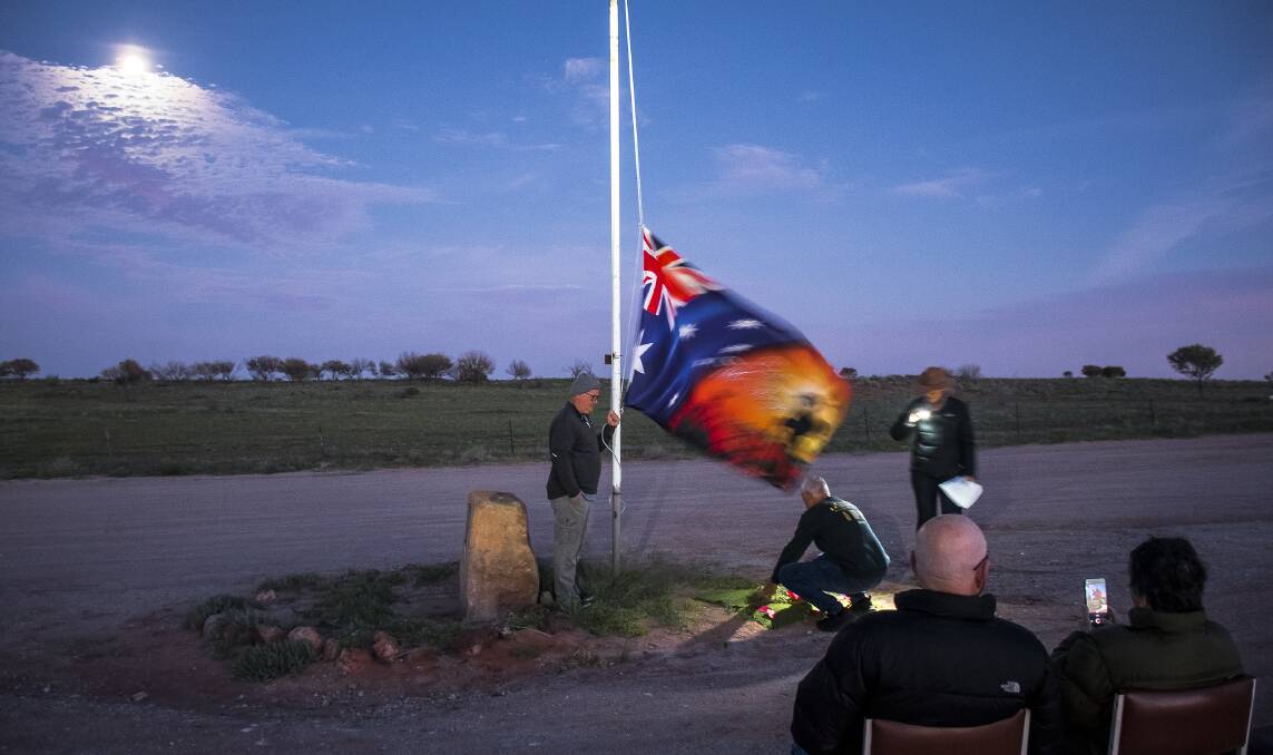 Former RAAF aircraft technician Mick Schreiber attended the raising and lowering of the flag while his mate a former RAAF avionic technician Alfie Stein laid a wreath made by Ms Partridge who led the service. Picture: Tim Rumble
