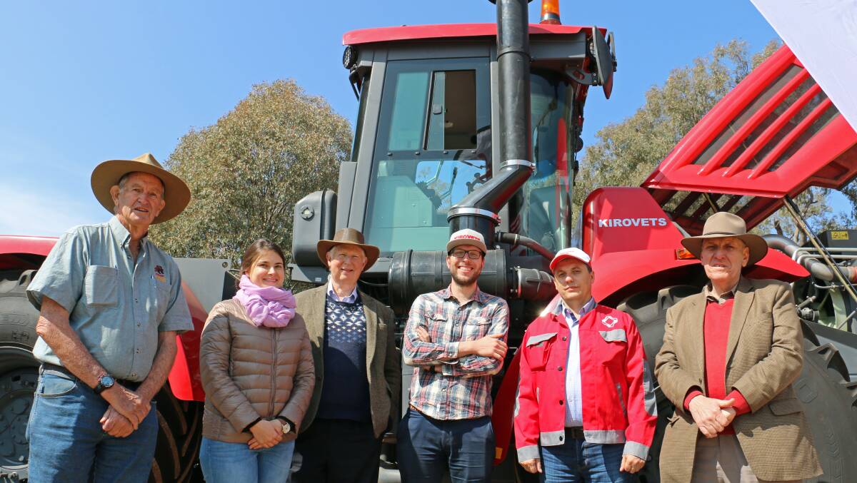 Peter Woods, Albury, Anna Kovaleva, Russia, Ross McDonald,
Melbourne, Alex Milne, Melbourne, Andrey Sagaev, Kirovets head service manager, and Craig Milne, Melbourne, with the K-744R at Henty Machinery Field Days.
