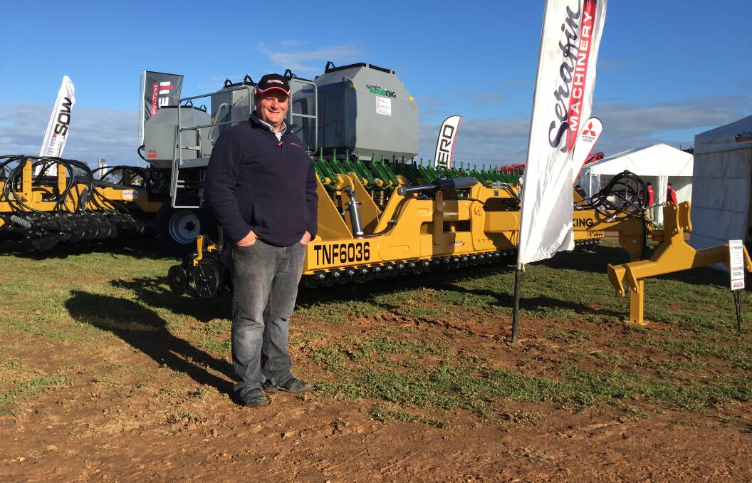 Serafin's Rodney Dunn with the company's new Pasture King air seeder that is designed to fill the niche between a combine and more expensive seeders but offer the versatility and precise seed placement accuracy.