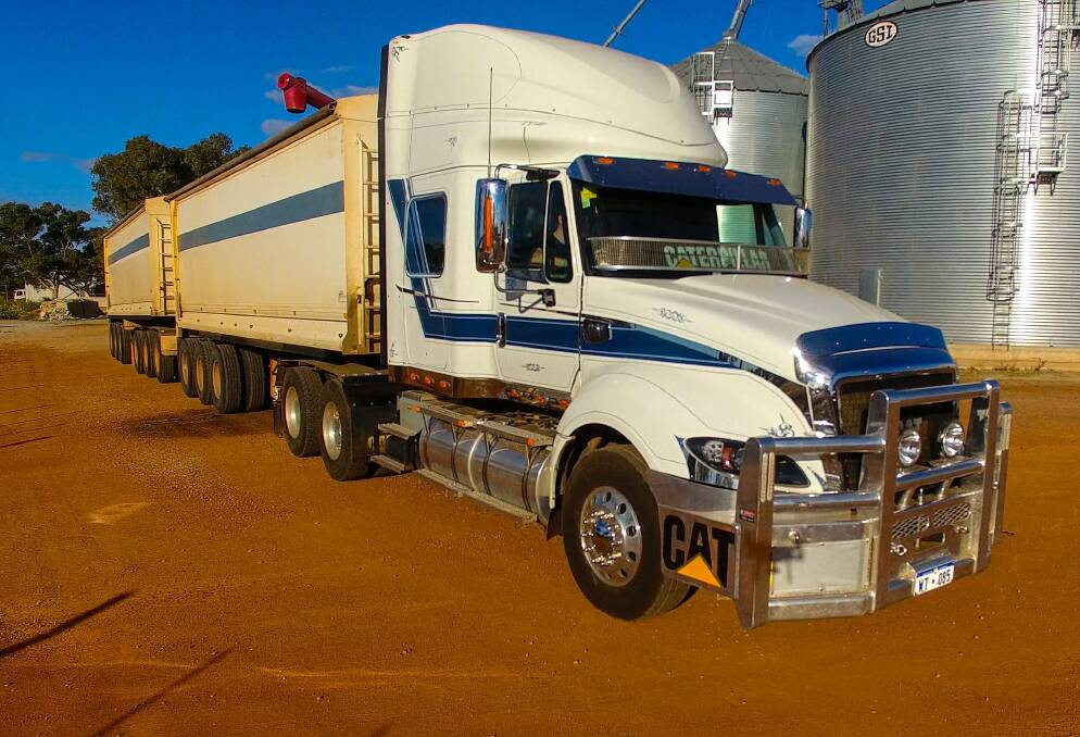 A fleet of eight Cat trucks, including this CT630HD, 130 tonne road train spec, are keeping John Nicoletti's grain harvest on track this season.