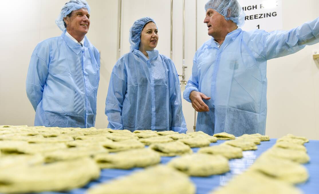 State State Development Minister, Anthony Lynham and Queensland Premier, Annastacia Palaszczuk inspect production lines with Sunny Queen Farms managing director, John O'Hara.