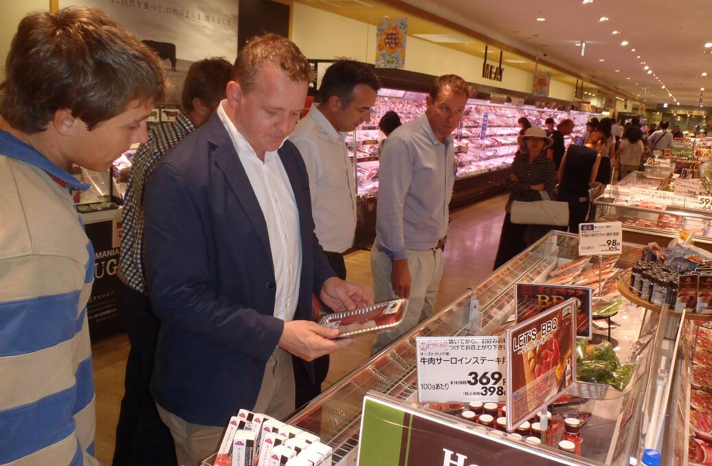ANZ agribusiness delegation members checking out Australian meat products in a Tokyo supermarket with Meat and Livestock Australia's Japan-based regional manager, Andrew Cox.