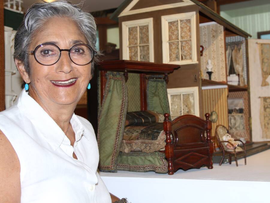 Children Delight: Connie Kimberley in front of one of dolls houses that have been restored and are on display at the new children's toy shop.