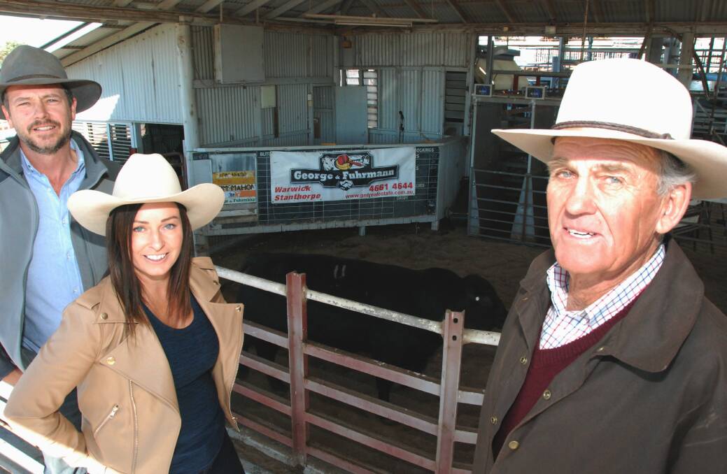 Andrew Bryant and Francesca Webster with top price bull buyer Don Marshall, Heather Brae, Greymare.