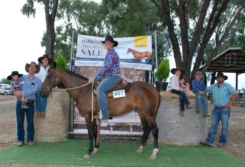 Kerrie Thompson riding Oneofakind Dixie Chic mare who topped the Dalby Australian Stock Horse Sale at $54,000 with buyer Andy Mulcahy (left), son Hugh Mulcahy and daughter Amy Mulcahy, Lily Mulcahy (right), Rose Habermann, Andy Mulchay Jr and horse owner Zane Habermann.