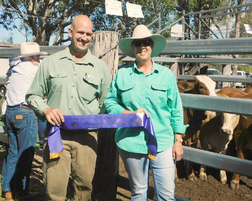 Richard Meacle, Landmark Rockhampton Animal Health with Kylie Parker, Bororen, winner of the Champion Pen of Heifers.