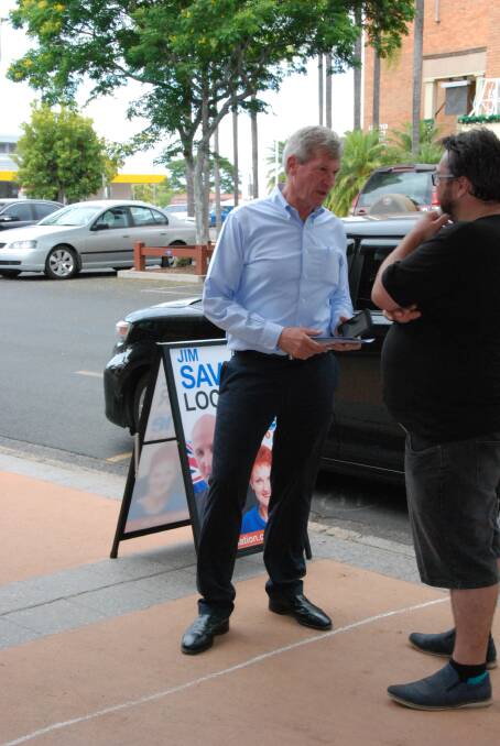 LNP Lockyer canidate Jim McDonald talks with locals in Gatton on Tuesday.