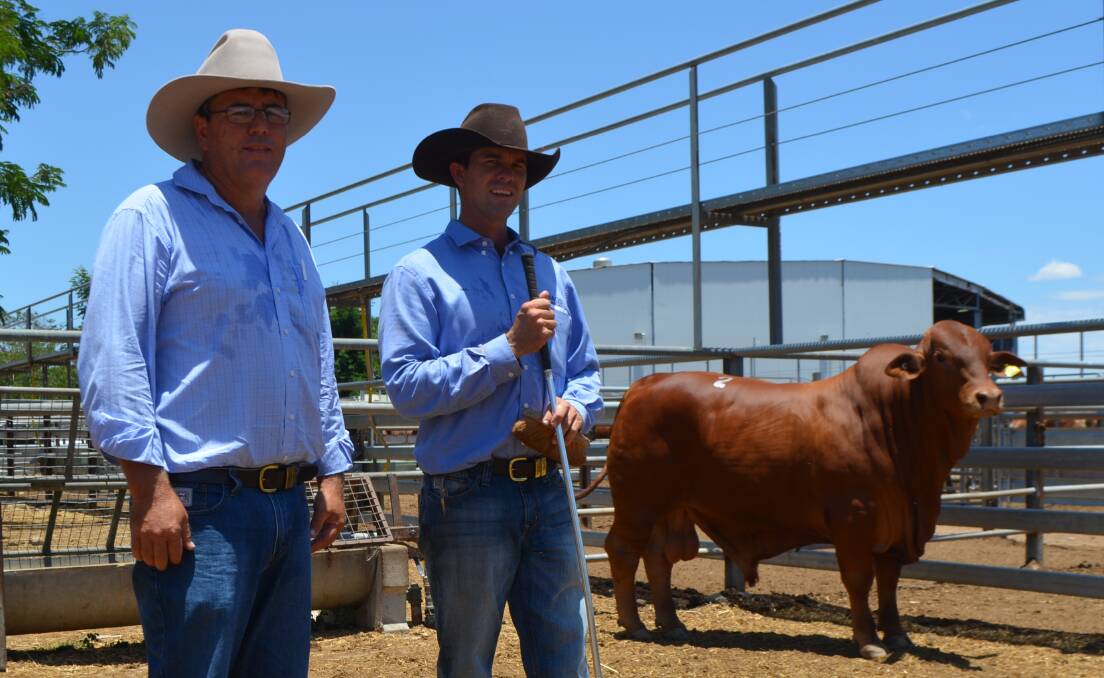 Vendor Mac Shann, Lamont Stud, Cantaur Park, Clermont, with $30,000 2016 MAGS Droughtmaster Sale top price bull Lamont Orlando 546 (S) and purchaser Jason Childs (left}, Glenlands Droughtmasters, Alkira, Dingo.