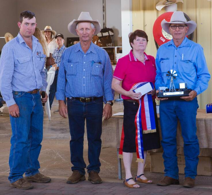 Jake Passfield and Dale Appleton with Grand Champion Exhibit winners Frank and Cathie Finger.