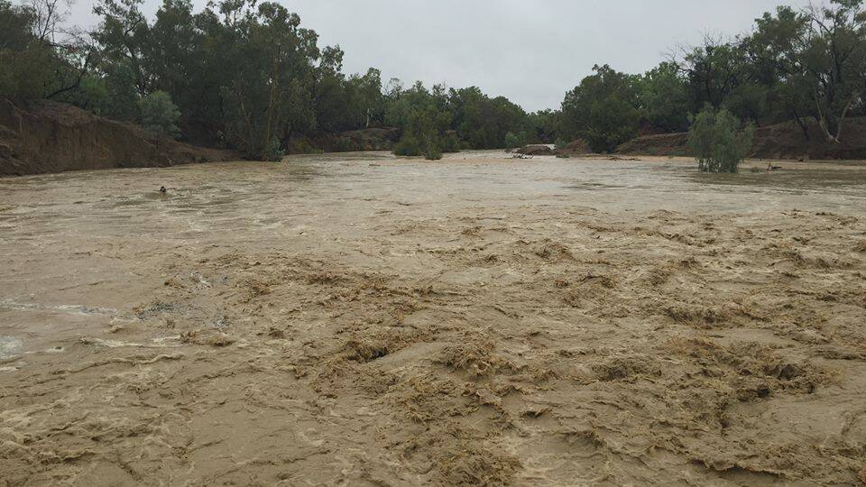 Running a banker: The Flinders River at Top Crossing, Richmond, taken at midday on Sunday. Richmond mayor John Wharton said it had been a cry creek bed at daylight but was running at a depth of five metres by noon. Picture: John Wharton.