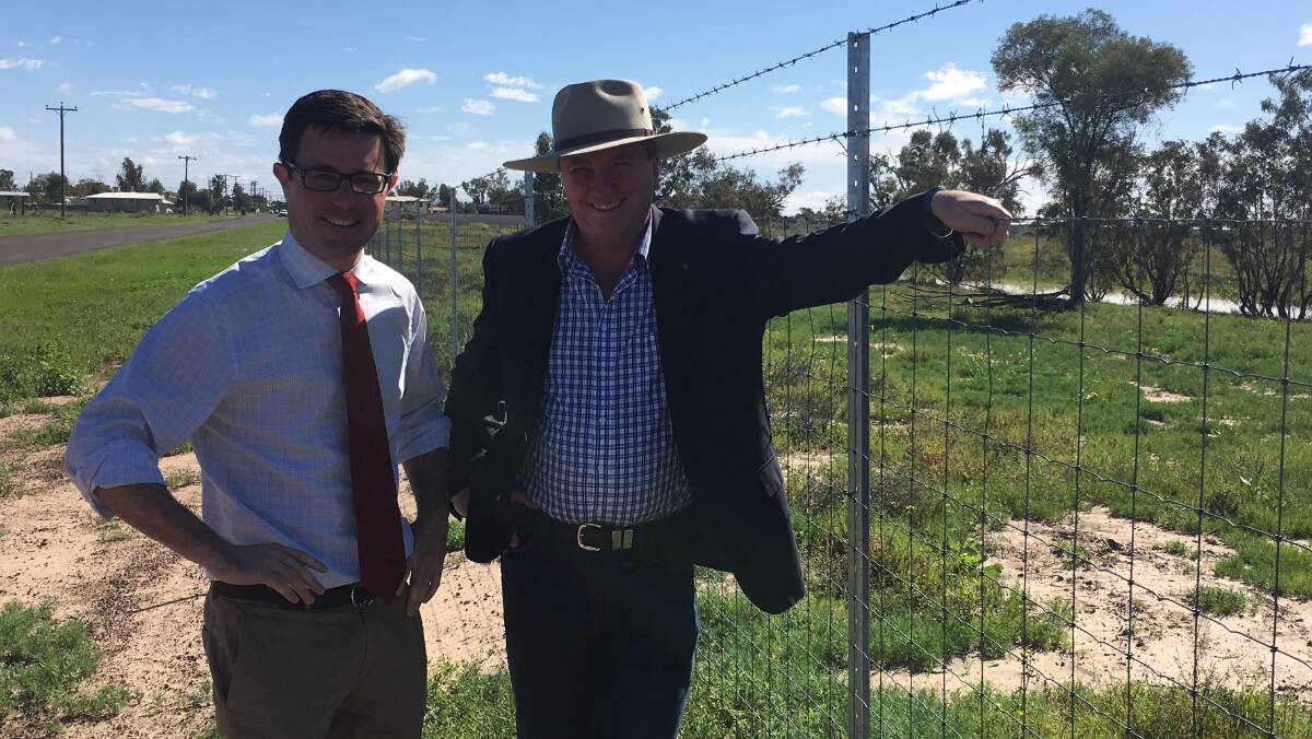 New barriers: Maranoa MP David Littleproud and acting Prime Minister Barnaby Joyce inspect a section of cluster fencing erected near Wyandra with money from the joint federal-state Queensland Feral Pest Initiative.