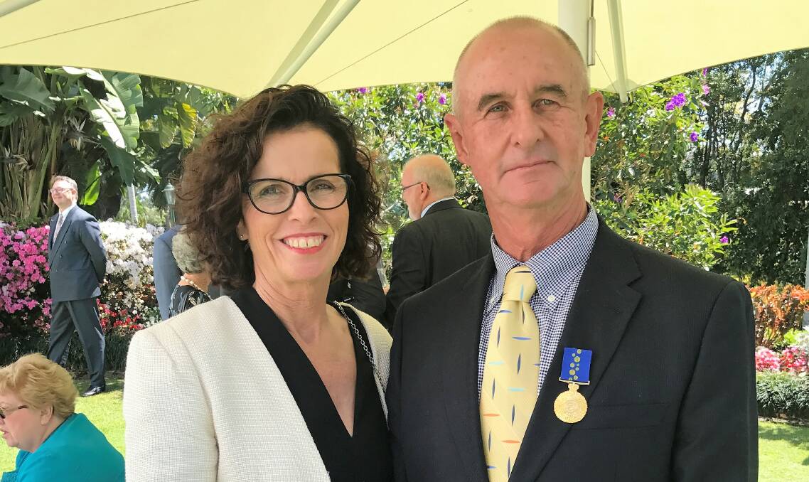 OAM: Bruce Scott, together with wife Maureen Scott, in the gardens of Government House following the investiture. Photo supplied by Maureen Scott.