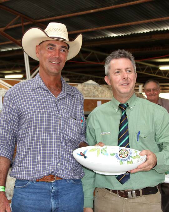 Prize pool: Shane Jones, Padua, Ilfracombe, receiving a fleece trophy from Landmark's north east regional wool manager, David Hart. Pictures: Sally Cripps.