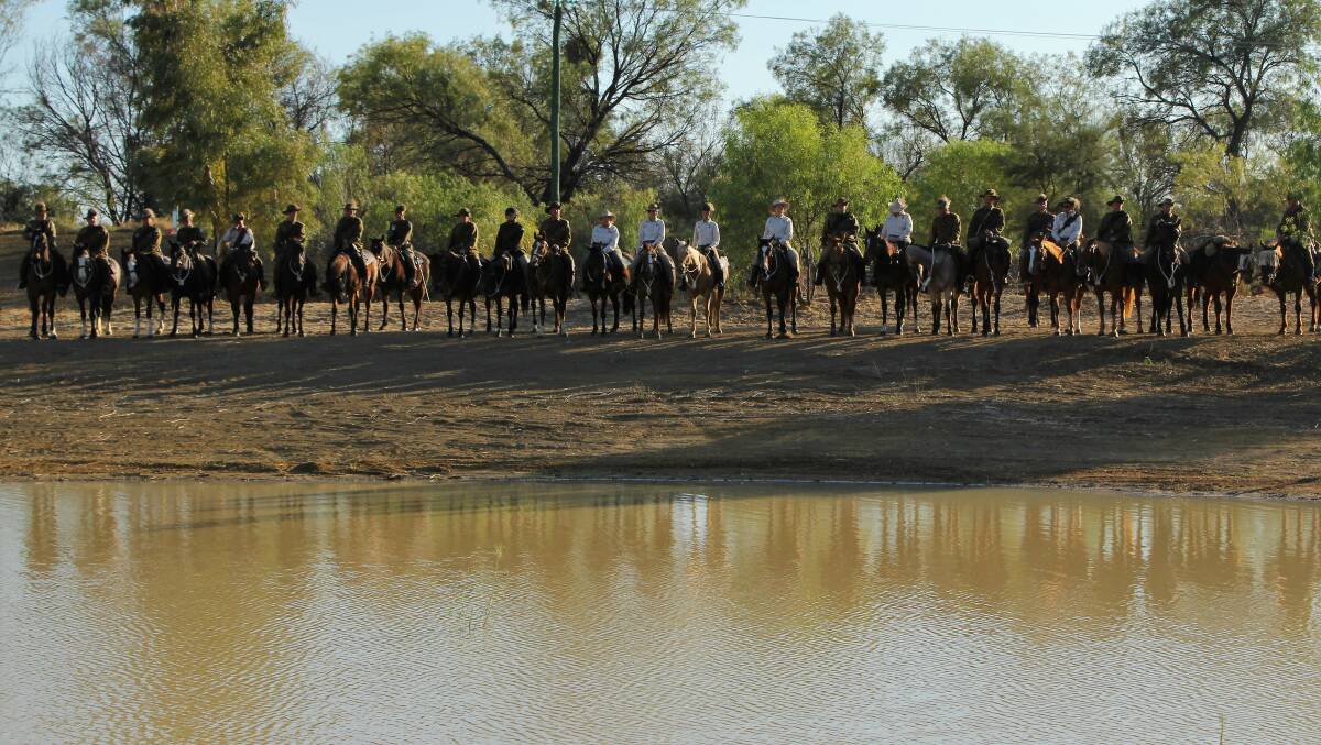 A section of the commemorative Light Horse troop reflected in the water of the newly opened Beersheba Place water park on Longreach's western outskirts.
