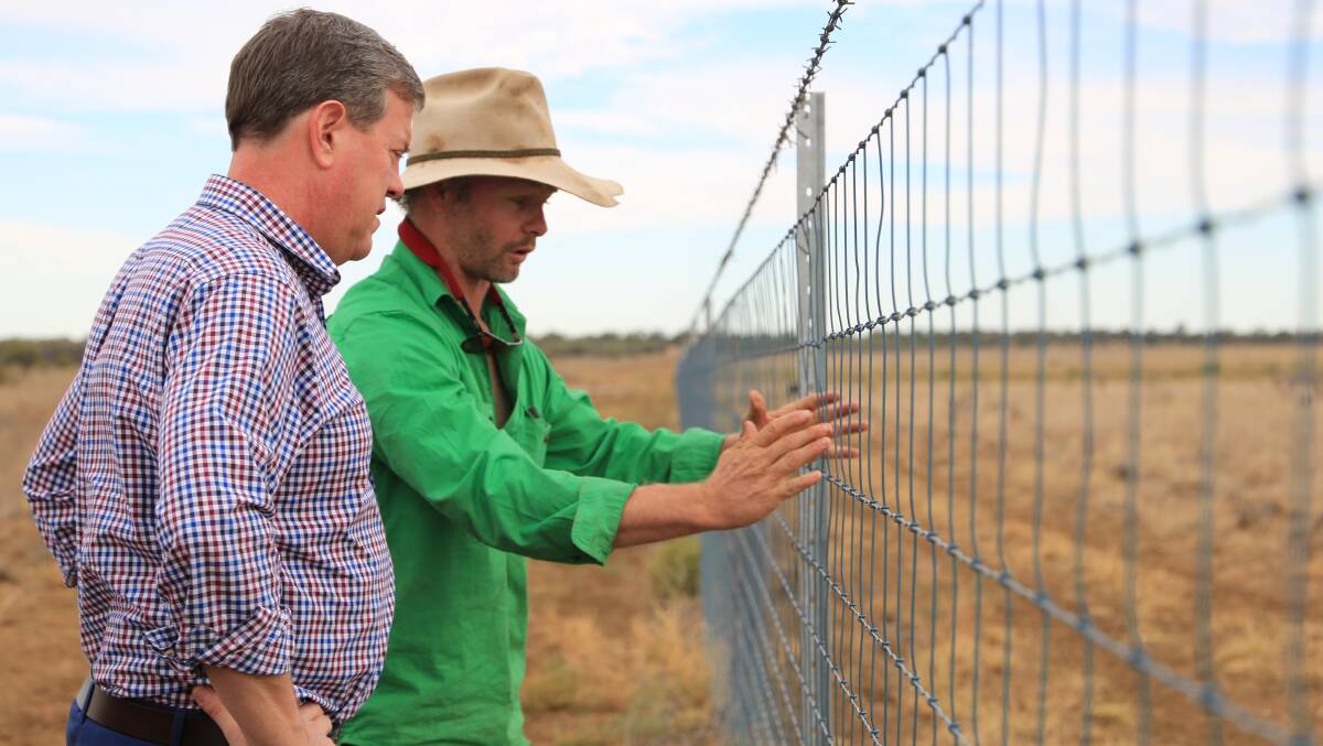 Barcaldine grazier Paul Doneley describes some of the exclusion fencing pressures to opposition leader Tim Nicholls.