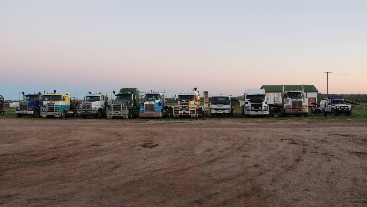 Nine of the 11 trucks parked at the Yaraka Hotel after being unloaded.