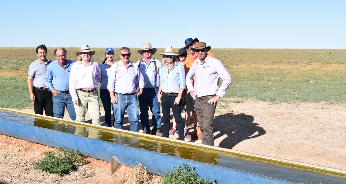 The Infrastructure and Natural Resources Parliamentary Committee at a stock route watering point between Boulia and Winton with Boulia Shire councillors and staff.