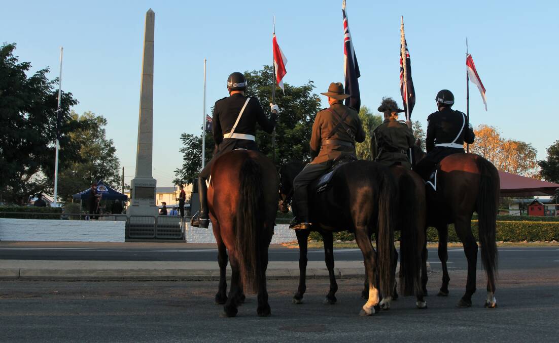The official colour party facing the Longreach cenotaph during Wednesday morning's tribute to the Australian and New Zealand troops who fought in the Middle East in the first World War.