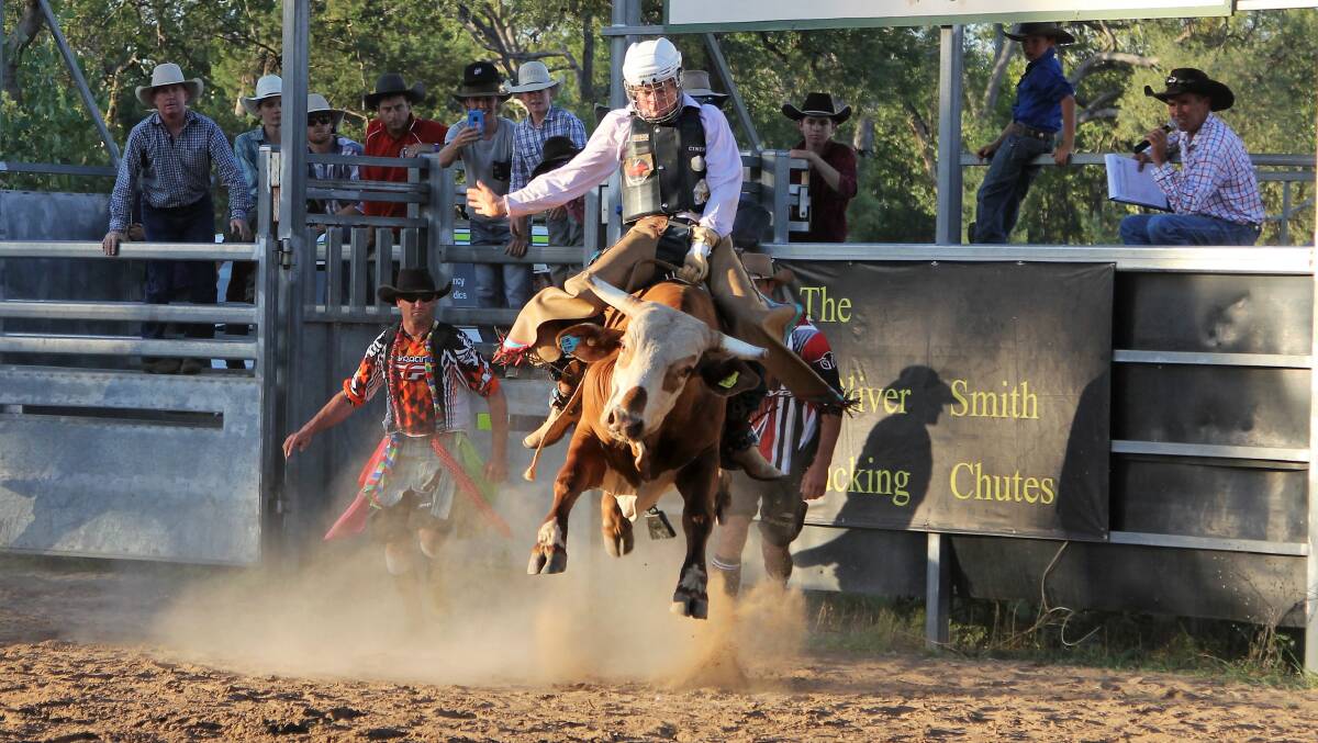 Blackall's Jack Banks on his way to a winning ride on Blindside in the juvenile bull ride.