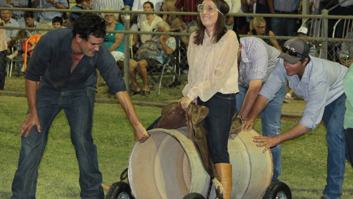 With her feet firmly in the stirrups, Susie Doyle gets ready to ride her steed around the barrels in the novel Barcoo Challenge night time event.