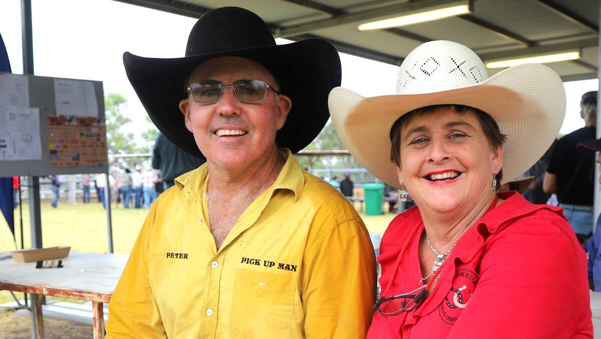 Damien's proud parents Peter and Maree Brennan, busy working at Tooloombilla rodeo. Picture: Sally Gall