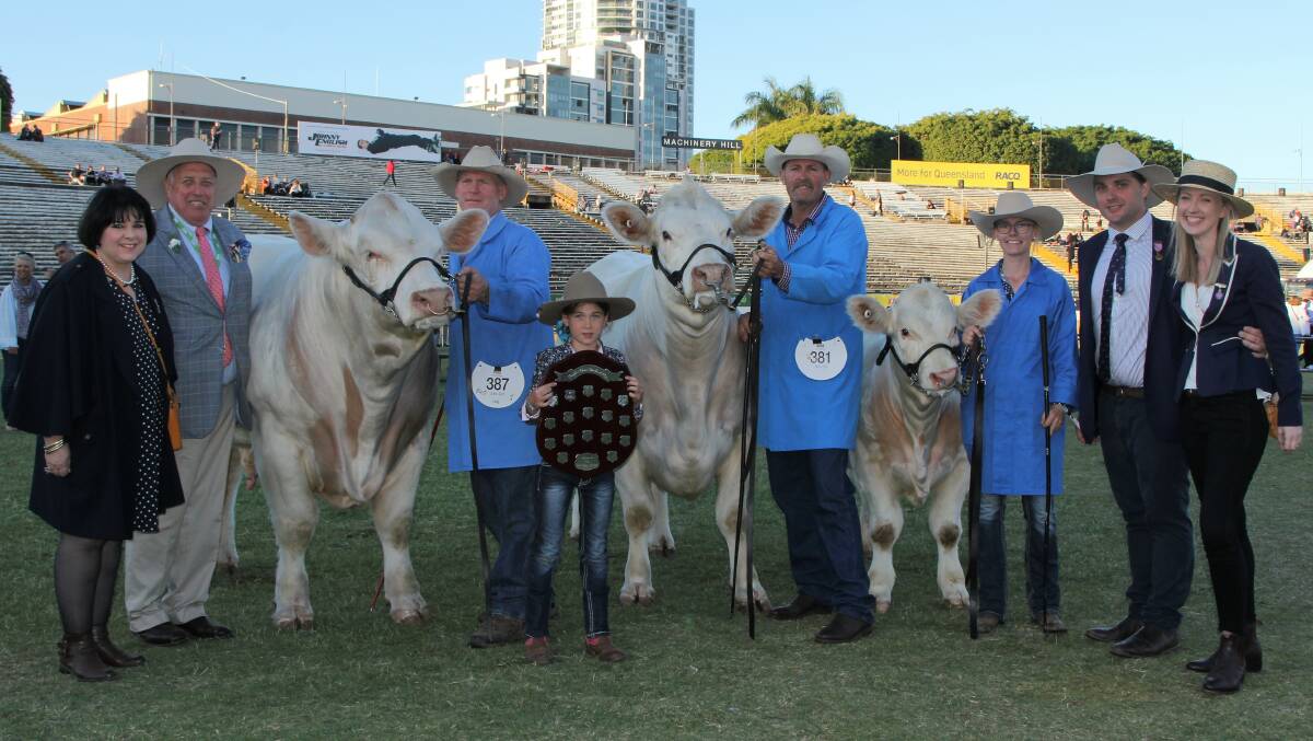 Paul and Bronwyn Cottrell, left, and Alex and Michelle Cottrell, right, present the Champion of Champions people's choice award to Moongool Charolais, represented by Ivan and Tori Price, and Mark and Chloe Kemph.