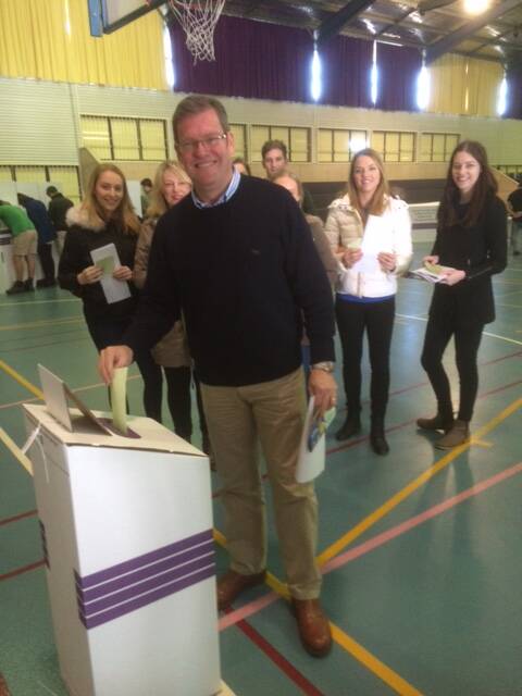 Groomed: Among those casting their ballot this morning were LNP candidate for Groom, John McVeigh, supported by his family. Picture: Helen Walker.