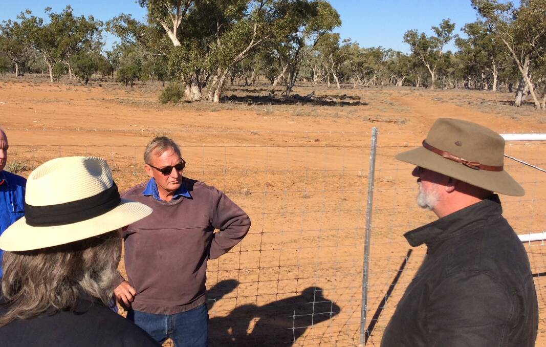 Wild Dog fencing commissioner, Mark O'Brien and Agriculture Minister, Bill Byrne, speaking with Geoff Dunsdon on a recent visit to Cunnamulla looking at exclusion fencing. Photo supplied.