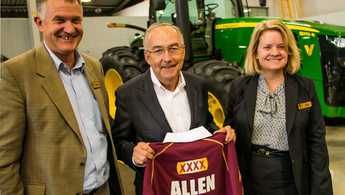 Only the best: Deere & Co chairman and CEO Samuel Allen, happily accepted a Queensland State of Origin jersey, is pictured with Bruce and Sue Vandersee during his visit to Vanderfield Toowoomba this week. Photo: contributed.