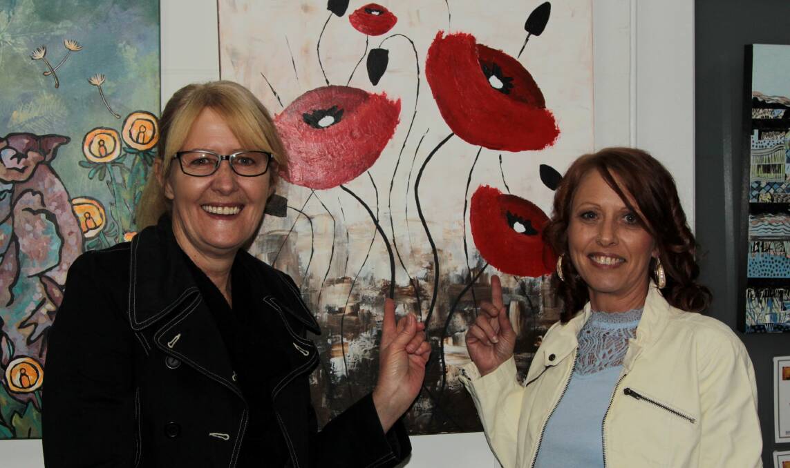An excited Jacqui Donaldson was sharing the news of her painting sales with her sister Jannene Daniels, out from Brisbane.