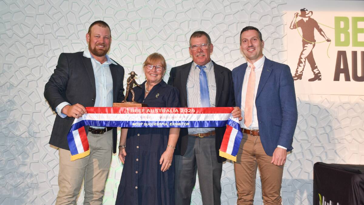 Matt, Bev and Peter Quinn, Essex Cattle Co, Middlemount, accepting the ribbon for most successful exhibitor from Nutrien general manager, Nutrien Ag Solutions, Kelly Freeman. Picture: Ben Harden