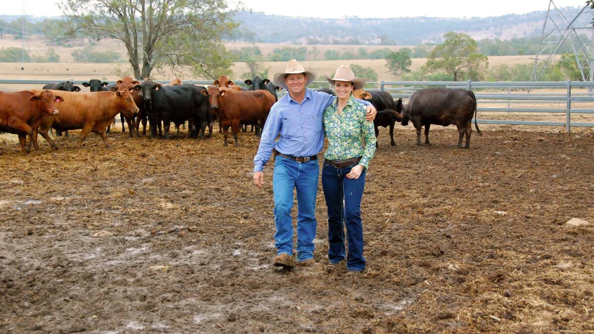 Ian and Megan Barbour, Holly Park, Kumbia enjoying their wet cattle yards in early October.
