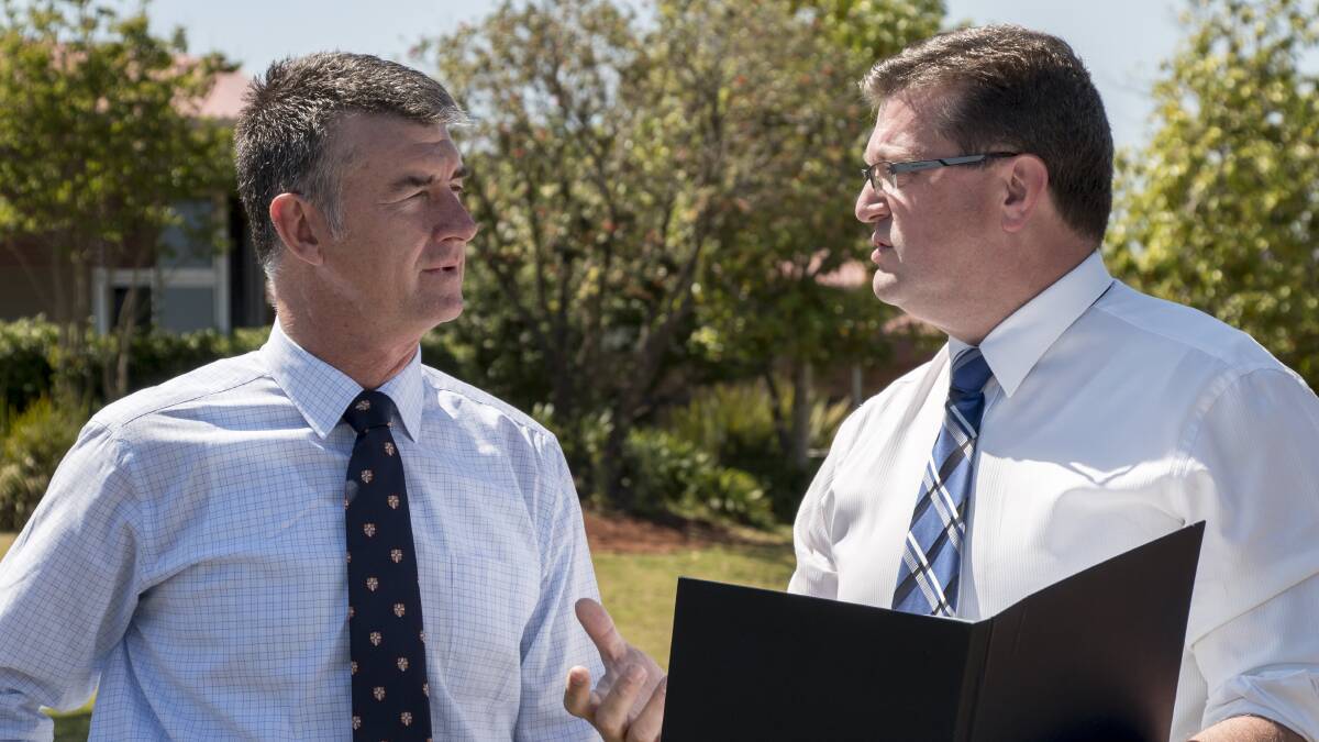 Opposition police spokesman Tim Mander, pictured with Toowoomba North Member Trevor Watts, successfully pushed a disallowance motion on firearms dealership regulations in state parliament, defeating a proposed government change.