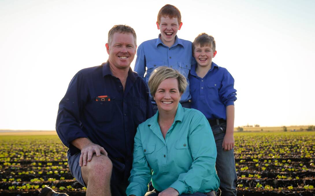 FAMILY FARMING: Kerry Downs' Bradley, Renee, Liam and Mitchell Anderson in this year's cotton field, near Emerald. 