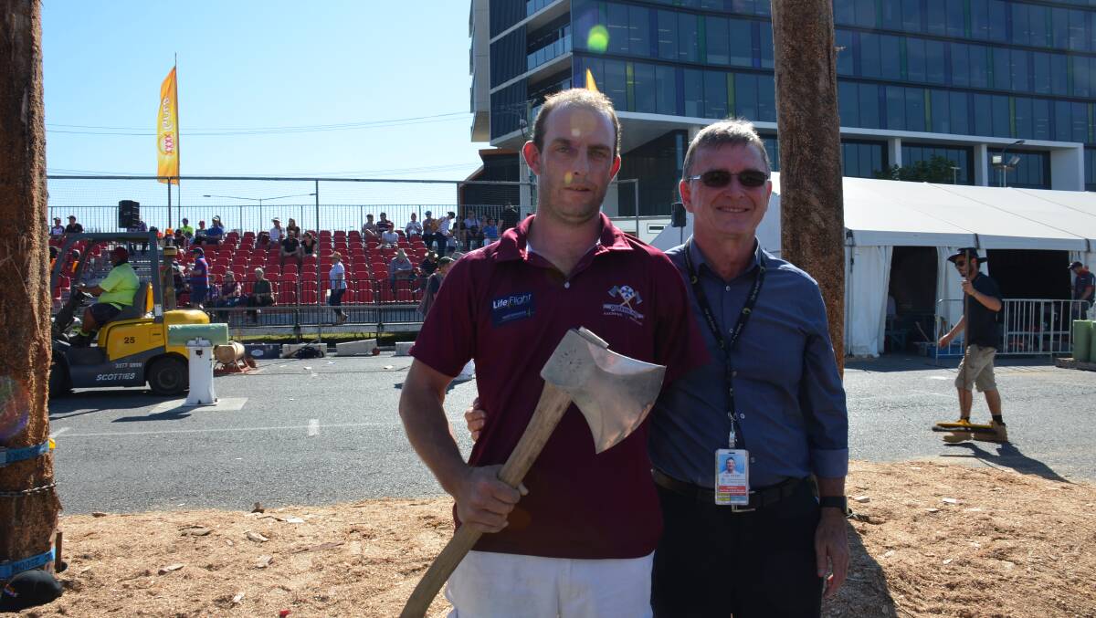 Nick Fredriksen reunited with Dr Colin Myers on hallowed ground at the Ekka woodchop arena today. Photo courtesy RACQ LifeFlight Rescue