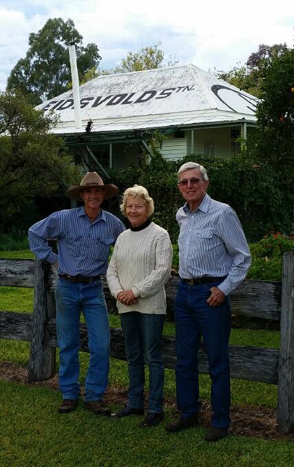 New beginnings: Rick Greenup celebrates the purchase of Eidsvold Station with previous owners Sally and Anthony Coates. 