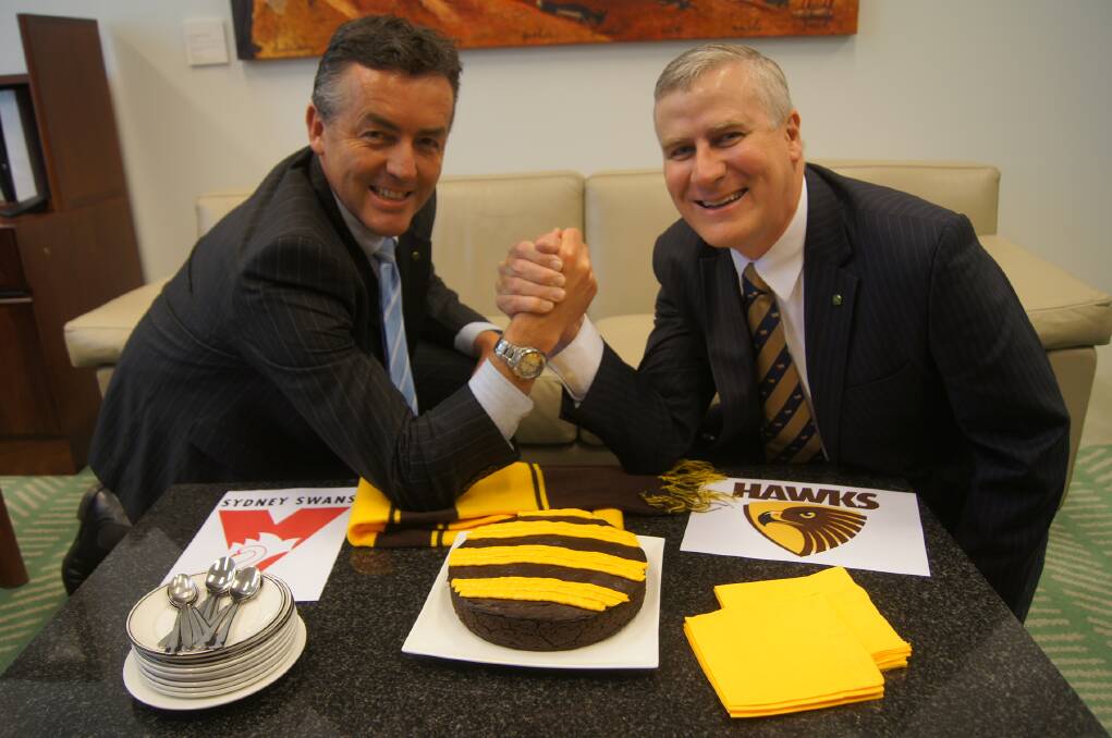 Victorian Nationals MP Darren Chester (left) and Michael McCormack slug it out over AFL rivalries.