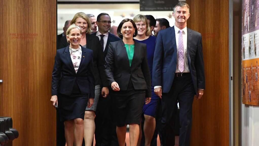 NEW LEADER: New LNP leader Deb Frecklington (centre) and her new deputy Tim Mander (right) walking in to the party room meeting that saw their elevations. Photo: Dan Peled/AAP