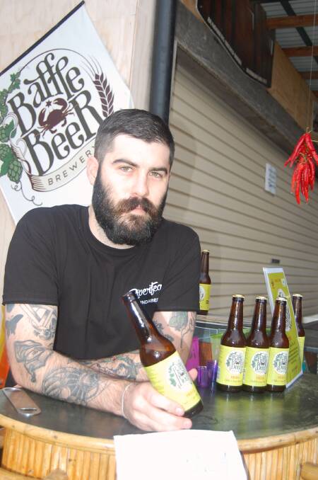 GOOD DROP: Riverfeast's craft beer expert, Jeremy Wittkopp, with a Fiesta beer, during the Riverfeast Chilli and Lime Fiesta in Bundaberg earlier this year. The beer sold out at the event. 