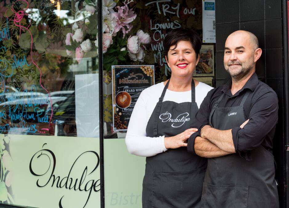 FOOD LOVERS: Former owners and creators of Indulge Cafe, Amanda and Larry Hinds, outside the Bundaberg establishment which raised the bar in terms of using local ingredients. Photo: Paul Beutel