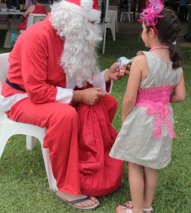  COOL COMFORT: This bush Santa does his best to moderate the temperature through relaxed footwear at the Barcaldine Races. 