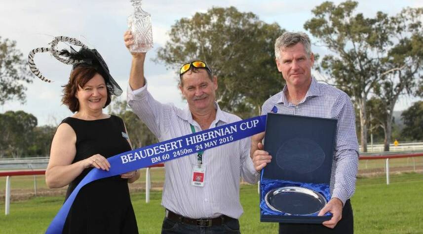 Beaudesert horse owner and trainer Robert Lyford, centre, whose horse Back to Abilene won the 2015 Beaudesert Hibernian Cup, receives his prizes from Cancer Council Beaudesert president Jenny Enright and Beaudesert Hibernian Charity Race Day president Tim Kelly.