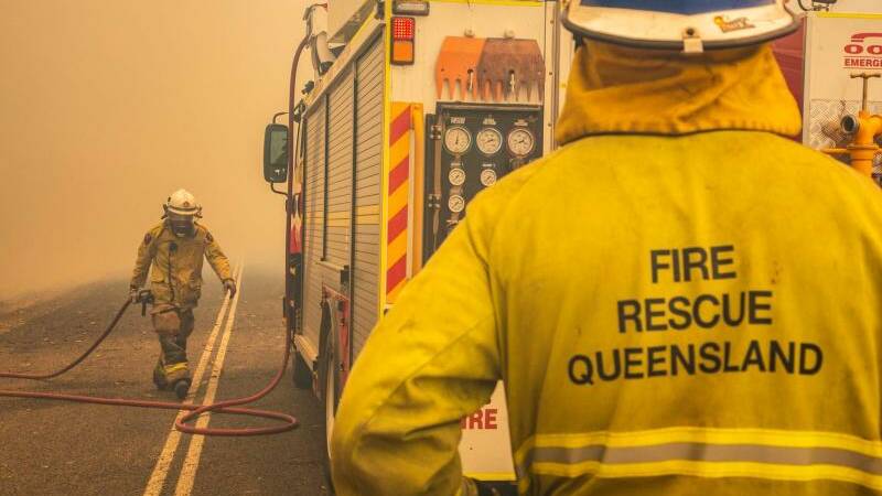 Firefighters working to control a bushfire in Deepwater, Central Queensland. Photo: QFES Media