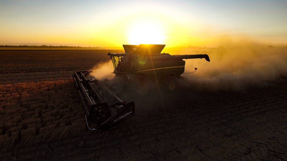 "The 2015 chickpea harvest continues at Reardon Farms, Talwood, Queensland. The sun may be setting, but harvesting is set to continue well into the evening on another dry, dusty day." Photo: Jason Redgwell