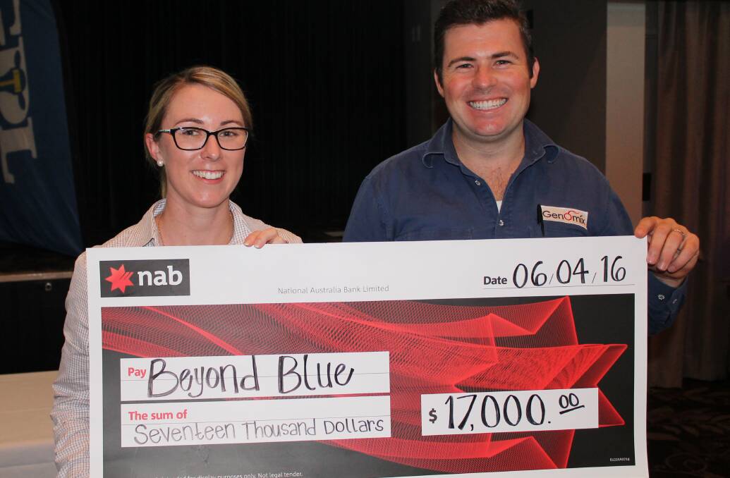 SOLID RESULT: Emma Hayward, NAB Agribusiness manager, Toowoomba and Jonny Arkins, Genomix presents the $17,000 cheque for beyondblue.