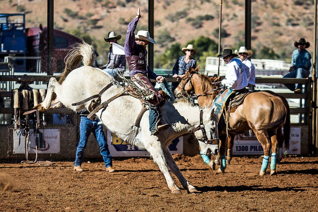 Micheal Maher, aboard Garry McPhee's champion bucking Bronc 'Cajun Man' marks 75pts for an aggregate 150 and wins his third consecutive Mount Isa Saddle Bronc title. - Picture: Stephen Mowbray Photography