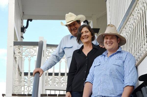 Alex, Annette, and Josh Long, on the stairs of their recently refurbished homestead, Court Le Roi, Kilcoy. 