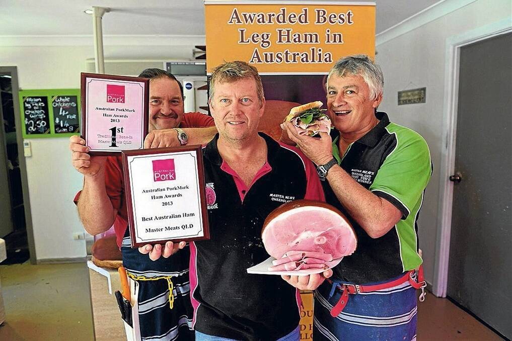 Sunshine Coast smallgoods maker Paul Rae (centre) shows off the best ham in Australia with Vector Fowler and Rob Glenny.